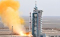 A Long March-4C rocket carrying the fourth group of China's Yaogan-31 remote sensing satellites blasts off. Photo by Wang Jiangbo/Xinhua.
