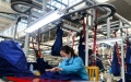 A worker operates on factory in north China's Hebei Province. Photo by Xinhua/Jin Haoyuan.