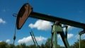 Oil prices hovered near two-week highs on Monday