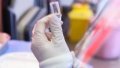 A medical worker prepares a dose of COVID-19 vaccine on a mobile vaccination vehicle in Beijing. Photo by Xinhua.
