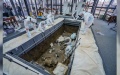 Archaeologists are shown excavating one of the six newly discovered pits at the site of Sanxingdui in China. Photo by Xinhua.