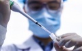 A staff member tests samples of the COVID-19 inactivated vaccine. Photo by Xinhua.