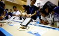 People experience e-books at Shanghai Book Fair. Photo by Xinhua/Fang Zhe.