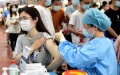 A woman receives a dose of COVID-19 vaccine at a vaccination site at Anhui Agricultural University in Hefei, east China's Anhui Province. Photo by Xinhua/Huang Bohan.
