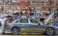 Workers assemble vehicles at an FAW–Volkswagen Automobile Co Ltd facility in Changchun, Jilin province. Photo by Xinhua.