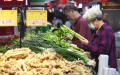 Customers select vegetables at a supermarket in Guiyang, southwest China's Guizhou Province. (Xinhua/Zhao Song). Photo by Xinhua.