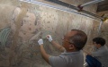 A cultural relics expert restores a mural at the Yongle Palace in Ruicheng County of Yuncheng, north China's Shanxi Province. Photo by Xinhua.