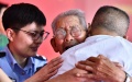 Luo Fengkun, 90, hugs his son Luo Yajun, who was abducted 58 years ago, during a reunion event in Jinan, east China's Shandong Province. Photo by Xinhua/Guo Xulei.