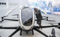 Visitors learn about an autonomous aircraft on display. Photo by Xinhua/Cheng Min.