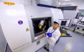 A technician of Contemporary Amperex Technology Co Ltd checks an electric vehicle battery at the company's plant in Ningde, Fujian province. Photo by Xinhua.