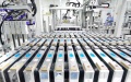 A worker operates on a production line at a lithium battery factory in Tangshan, north China's Hebei Province. Photo by Xinhua/Yang Shiyao.