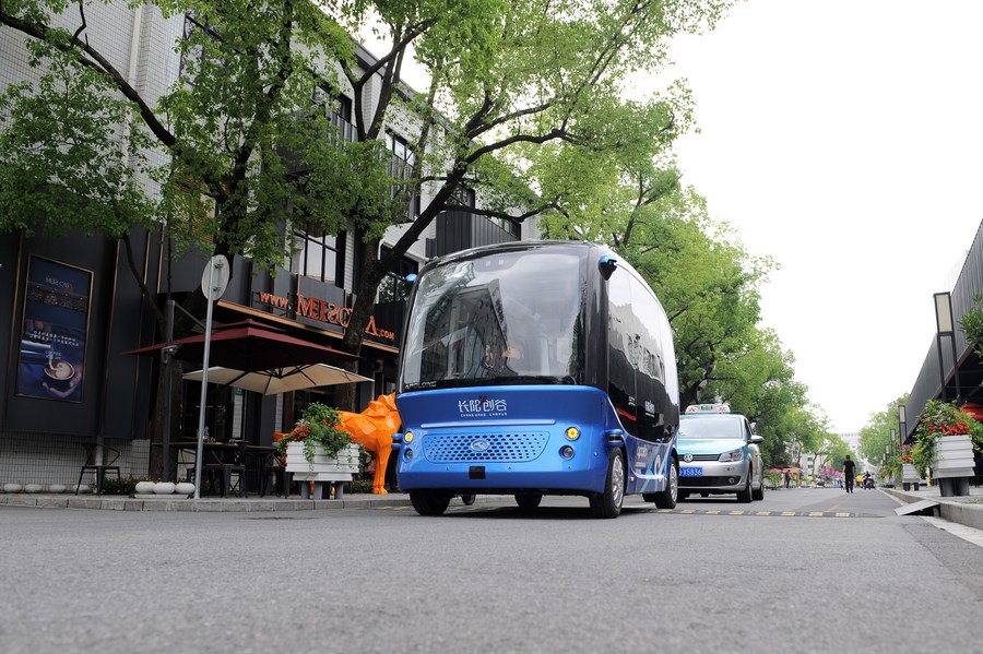 A self-driving bus is seen running on a road of Changyang Campus in Yangpu district, east China's Shanghai. Photo by Xinhua/Ren Pengfei.