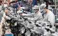 People work at a workshop of Harbin Dongan Automotive Engine Manufacturing Co., Ltd. in northeast China's Heilongjiang Province. Photo by Xinhua/Wang Jianwei.
