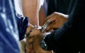Arrest for bribery. Photo by Xinhua.
