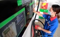China to raise retail fuel prices. Photo by Xinhua.