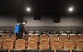 A staff member disinfects the hall at a cinema in Harbin, capital of northeast China's Heilongjiang Province. Photo by Xinhua/Zhang Tao.