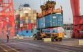 Cargos are unloaded from a container ship at the container terminal of the Lianyungang Port in Lianyungang City, east China's Jiangsu Province. Photo by Xinhua/Wang Jianmin.