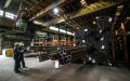 Workers inspect seamless steel tubes at a plant of Ansteel Group Co., Ltd. in Anshan, northeast China's Liaoning Province. Photo by Xinhua/Pan Yulong.