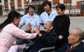 Caring for the elderly person in China. Photo by Xinhua.