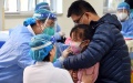 A child receives a dose of COVID-19 vaccine in the Xueyuanlu subdistrict of Haidian District, Beijing, capital of China. Photo by Xinhua/Ren Chao.