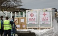 Workers prepare to transfer China-donated COVID-19 vaccines at the Abeid Amani Karume International Airport in Zanzibar, Tanzania. Photo by Xinhua.