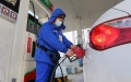 A staff member refuels a vehicle at a gas station in Lianyungang City, east China's Jiangsu Province. Photo by Wang Jianmin/Xinhua.