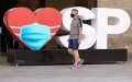 A pedestrian wearing a face mask walks on the street in Sao Paulo, Brazil. Photo by Str/Xinhua.