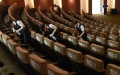 Staff members disinfect the seats at a movie theater in Shanghai, east China. Photo by Xinhua/Ren Long.