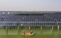Electricity workers patrolling amid a photovoltaic and wind power generation project installed above the fishery waters in Sheyanghu Township of Baoying County of Yangzhou, east China's Jiangsu Province. Photo by Xinhua/Li Bo.
