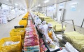 Workers pack Luosifen rice noodles at a food-processing company in Liuzhou City, south China's Guangxi Zhuang Autonomous Region. Photo by Xinhua/Huang Xiaobang.