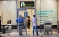 Tourists wait for COVID-19 test at Cape Town International Airport, South Africa. Photo by Xinhua.
