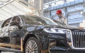 A worker checks a vehicle at the general assembly line of Hongqi, the leading sedan brand of First Automotive Works (FAW) Group Co. Ltd., in Changchun, northeast China's Jilin Province. Photo by Xinhua/Zhang Nan.