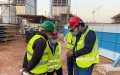 Undated file photo shows security manager Liu Jingkun (1st R) talking with colleagues at the construction site of a vast business district in Egypt's new administrative capital. Photo by CSCEC Egypt/Handout via Xinhua.
