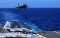 A carrier-based J-15 fighter jet preparing to land during open-sea combat training. Photo by Hu Shanmin/Xinhua.