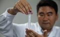 Chinese scientist Cai Tao shows a sample of synthesized starch at a lab. Photo by Xinhua/Jin Liwang.