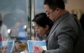 Patients pay their medical bills at Beijing Tongren Hospital. Photo by Mao Yanzheng.