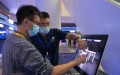 Participants experience quantum computing during the 2021 Quantum Industry Conference in Hefei, east China's Anhui Province. Photo by Xinhua/Han Xu.