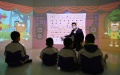 A therapist interacts with autistic children in a music workshop in Tianjin, north China. Photo by Xinhua/Li Ran.