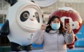 A visitor takes a selfie with decorative installations with the theme of 2022 Beijing Winter Olympics at Yanqing Railway Station in Yanqing District of Beijing. Photo by Xinhua/Ren Chao.