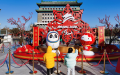 Several children looking at street decorations for the Beijing 2022 Olympic and Paralympic Winter Games before the upcoming Chinese Lunar New Year in Beijing. Photo by Xinhua.