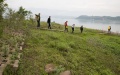 Researchers are seen at water level fluctuation zone of the Three Gorges Reservoir in Zhongxian County, southwest China's Chongqing.  Photo by Xinhua/Jin Liwang.
