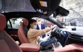 A visitor experiences a car from Chinese electric automaker Nio during China (Tianjin) Auto Show in north China's Tianjin. Photo by Xinhua/Li Ran.