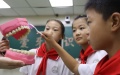 Students learn the right way to brush teeth at a school in Lincheng County of Xingtai City, north China's Hebei Province. Photo by Xinhua/Luo Xuefeng.