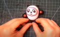 Handcraft teacher makes Beijing 2022 mascot Bing Dwen Dwen out of clay. Photo by Xinhua