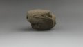 A pottery item resembling a pig at a relic site in the city of Ordos, north China's Inner Mongolia Autonomous Region. Photo by Xinhua.