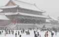 People brave the snow to visit the Palace Museum, or the Forbidden City, in Beijing. Photo by Xinhua/Jin Liwang.
