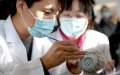 Staff members repair a broken porcelain at the archaeological workstation under the management office of Yuanmingyuan in Beijing, capital of China. Photo by Xinhua/Luo Xiaoguang.