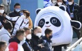 Participants take selfies with "Bing Dwen Dwen", the mascot of Beijing 2022 Winter Olympics, in capital of China. Photo by Xinhua/Ju Huanzong.