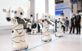 Service robots dance during the World Robot Expo in Beijing, capital of China. Photo by Xinhua/Ren Chao.