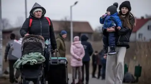 Украинские беженцы. Фото: Michael Kappeler